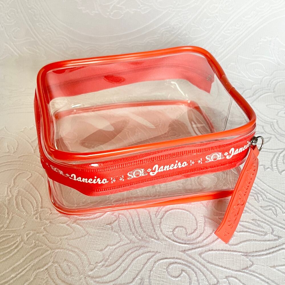 Sol De Janeiro Travel Pouch Clear Airplane TSA Cosmetic Bag Reusable Red Zipper